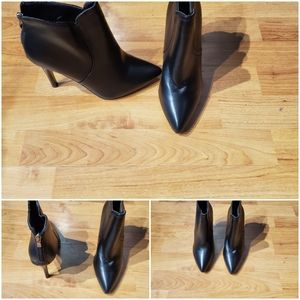 Black heeled Booties w/ zip up back never worn